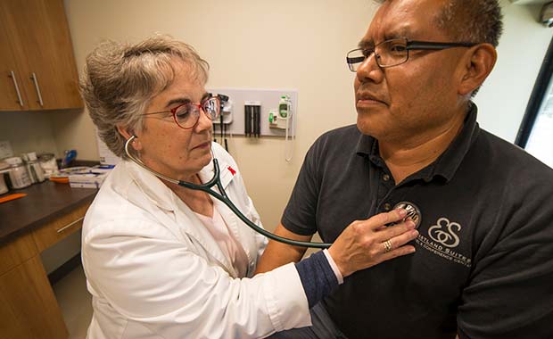 Nurse Practitioner Sue McGinnes examines a patient at Community Health Care Clinic in Normal, Ill. 