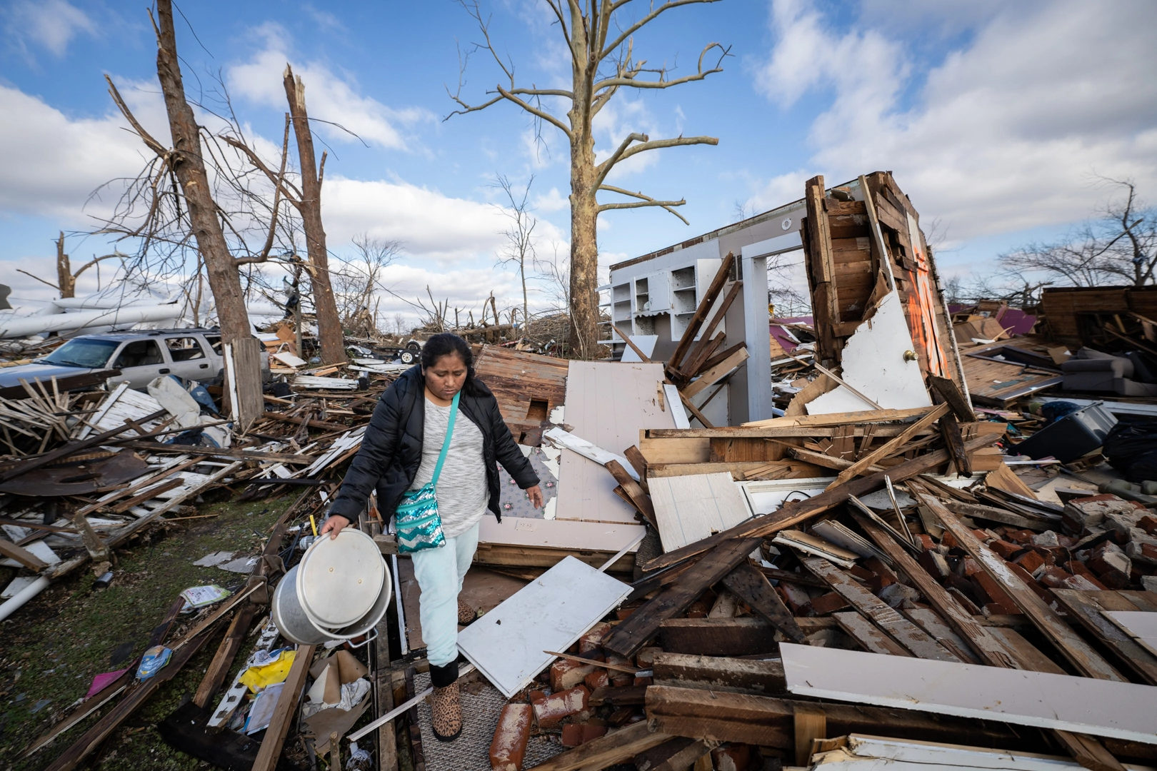 The Ramos family searches the rubble of their home