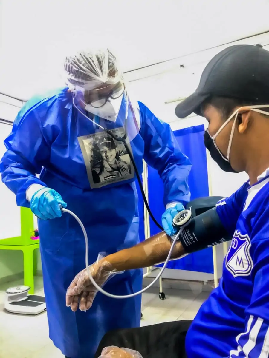 Americares Magdalena clinic health worker in Colombia checking patient