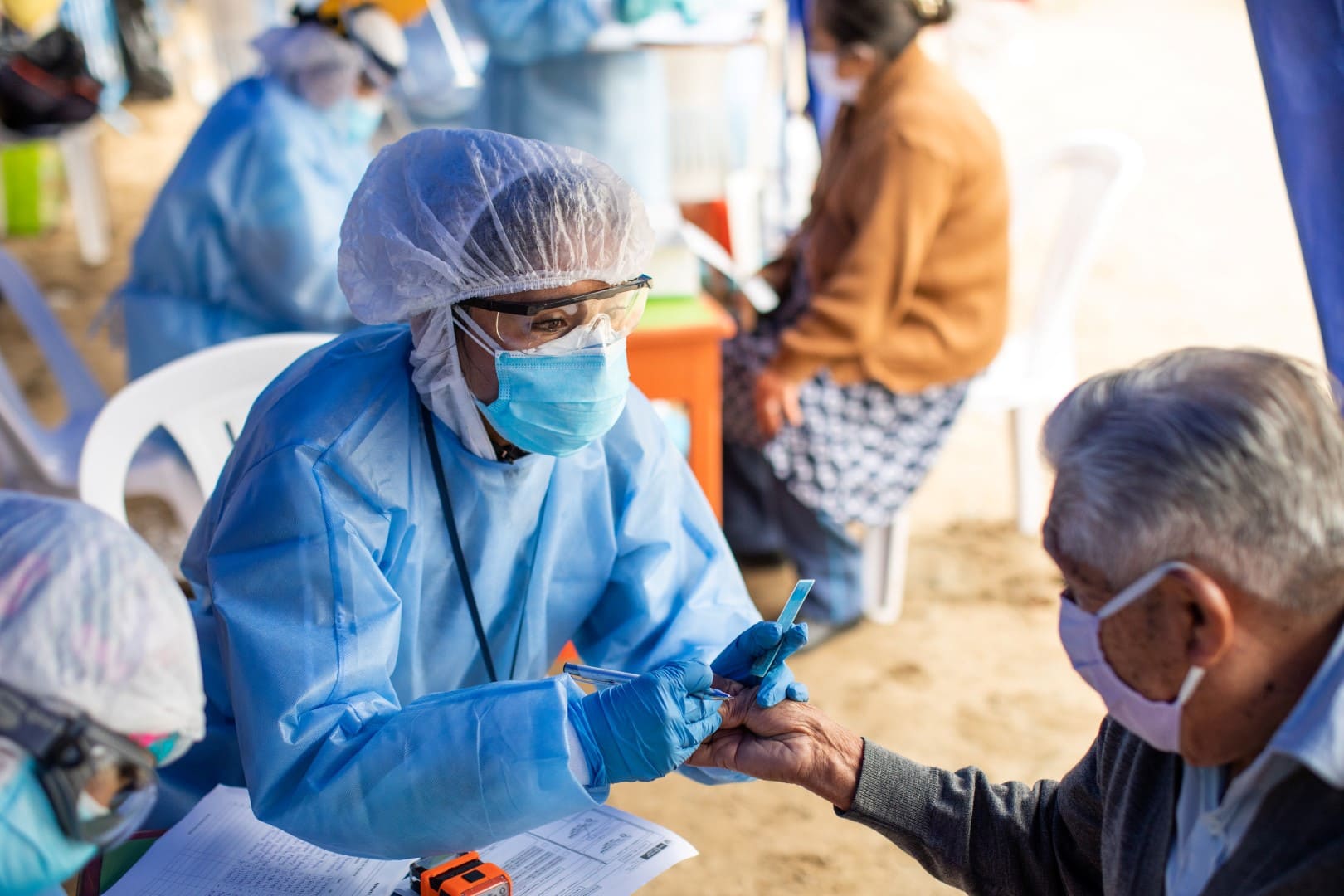 Patients receive medical care, including COVID-19 testing, at an Americares and VIDA Perú mobile clinic in Lima, Peru, on Aug. 29. Photo by Angela Ponce/Americares.