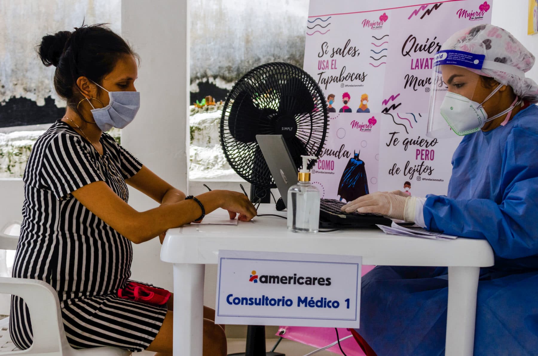 Doctor Bleidys having a medical consultation with 36-week pregnant patent Lucian who is at the clinic seeking prenatal care. Barranquilla, Colombia