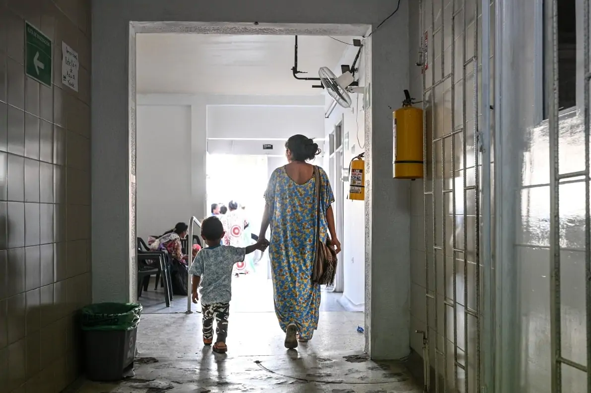 Mother bringing child to Americares clinic on Colombia Venezuela border