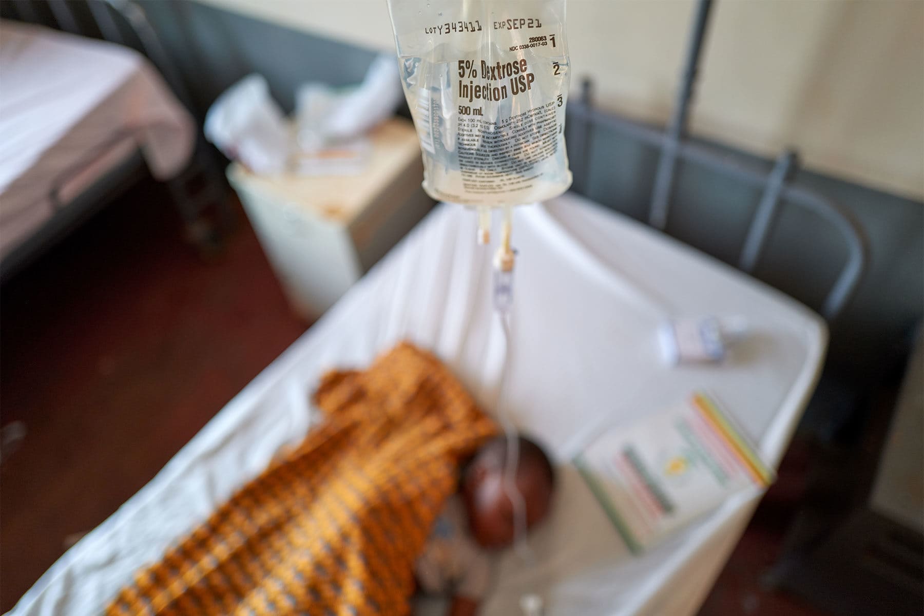 A 3-year-old boy receives an infusion of fluids from Americares delivered by drone to Nsuta Health Center in Ghana’s Ashanti Region. Photo by Nana Kofi Acquah/Americares.