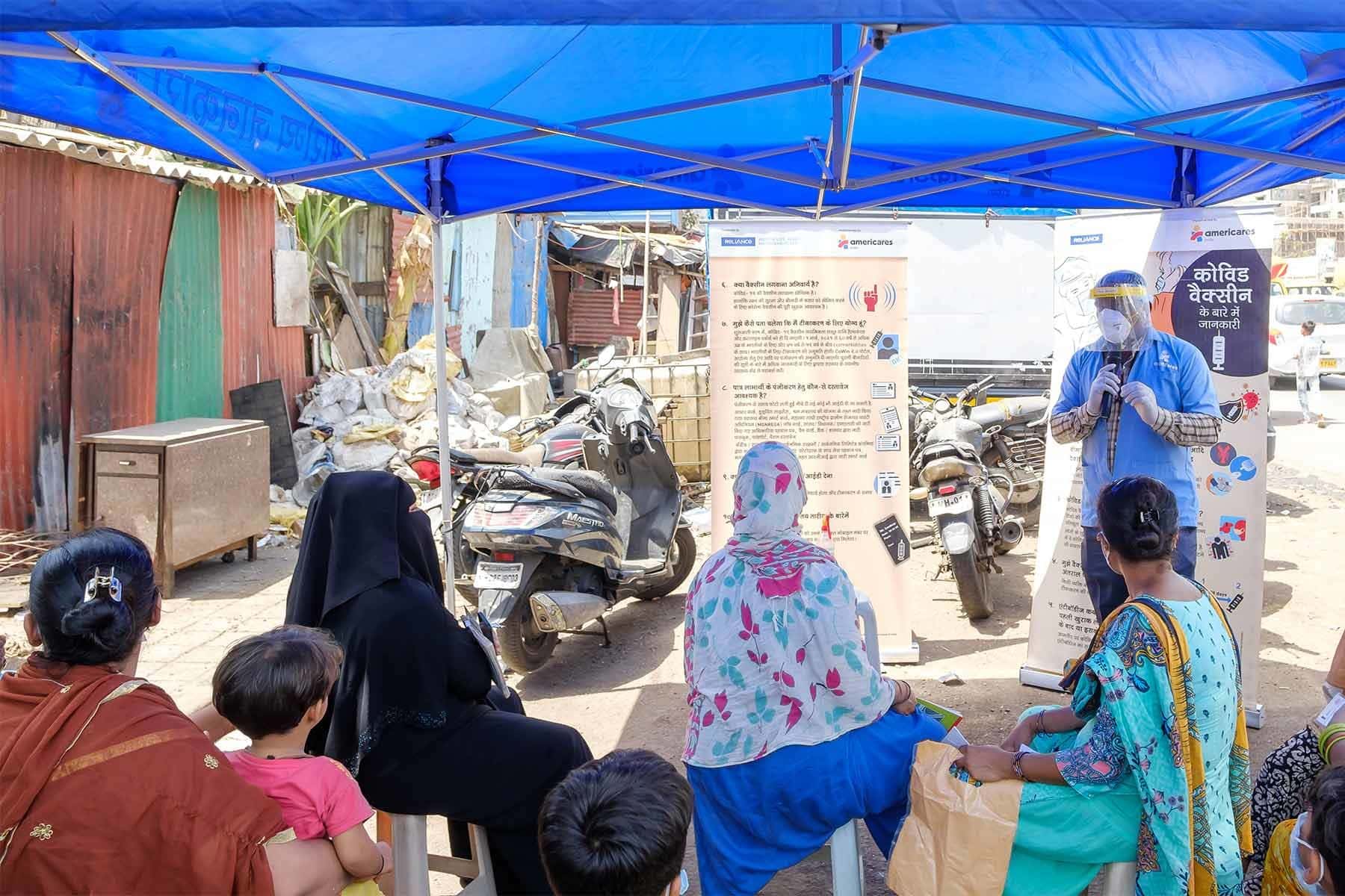 Americares India staff educates community members on COVID-19 prevention in Mumbai in April. Photo courtesy of Americares India.