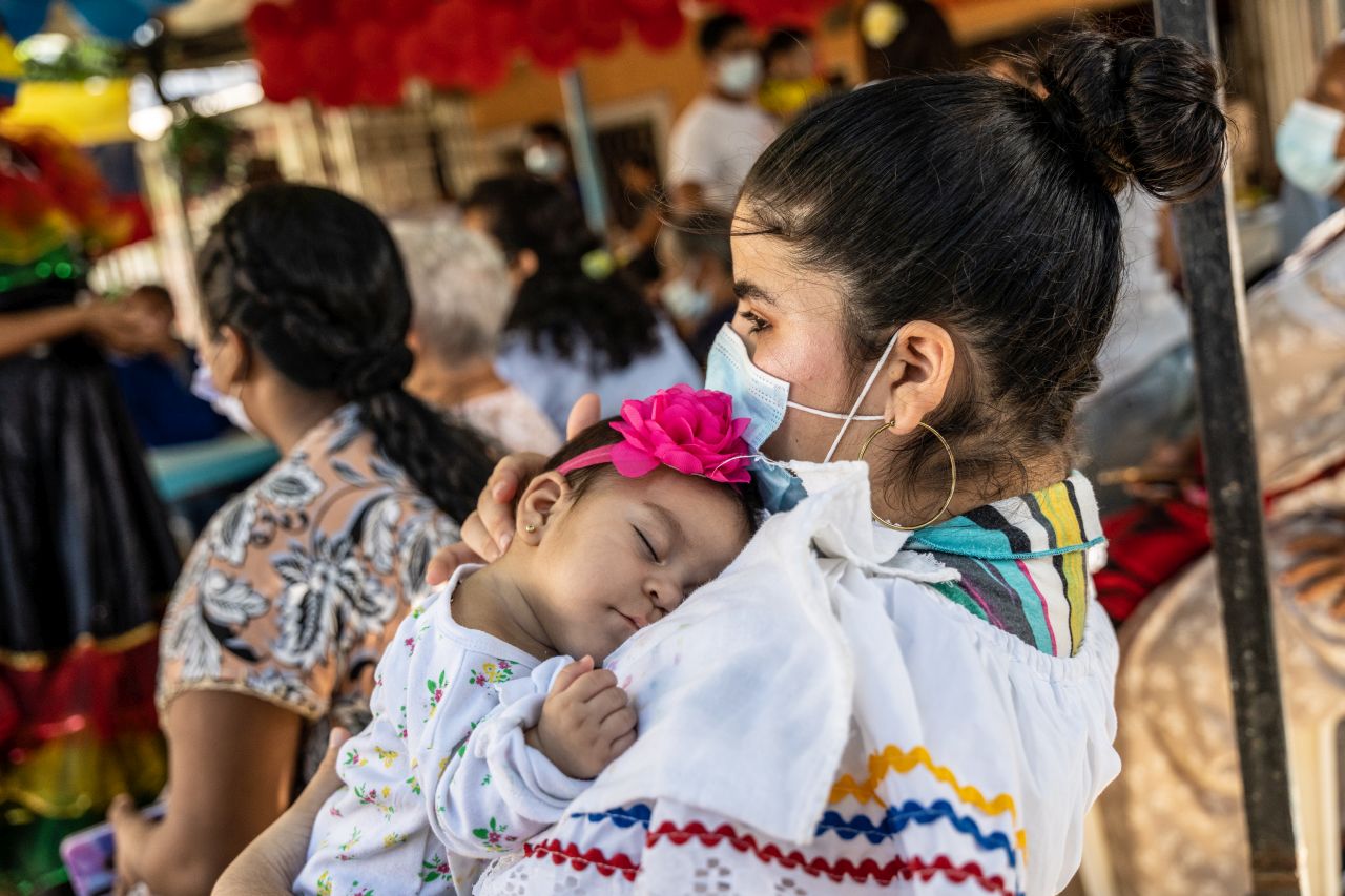 A mother and child join the celebration