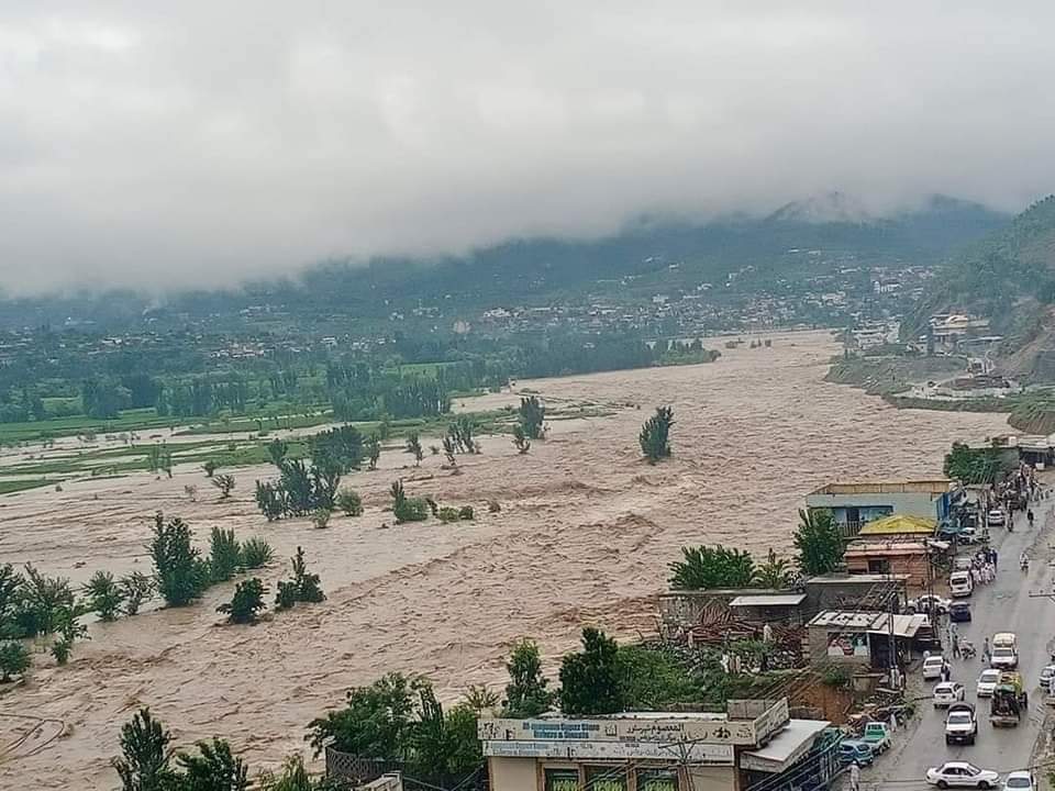 Rushing and expanding floodwaters threaten communities along the banks.