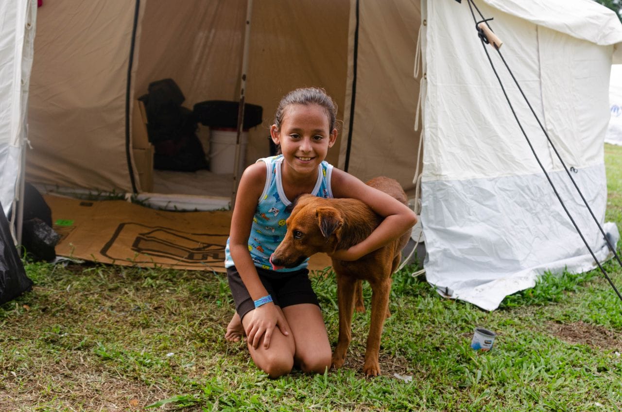 Daughter hugging the family dog Rocky