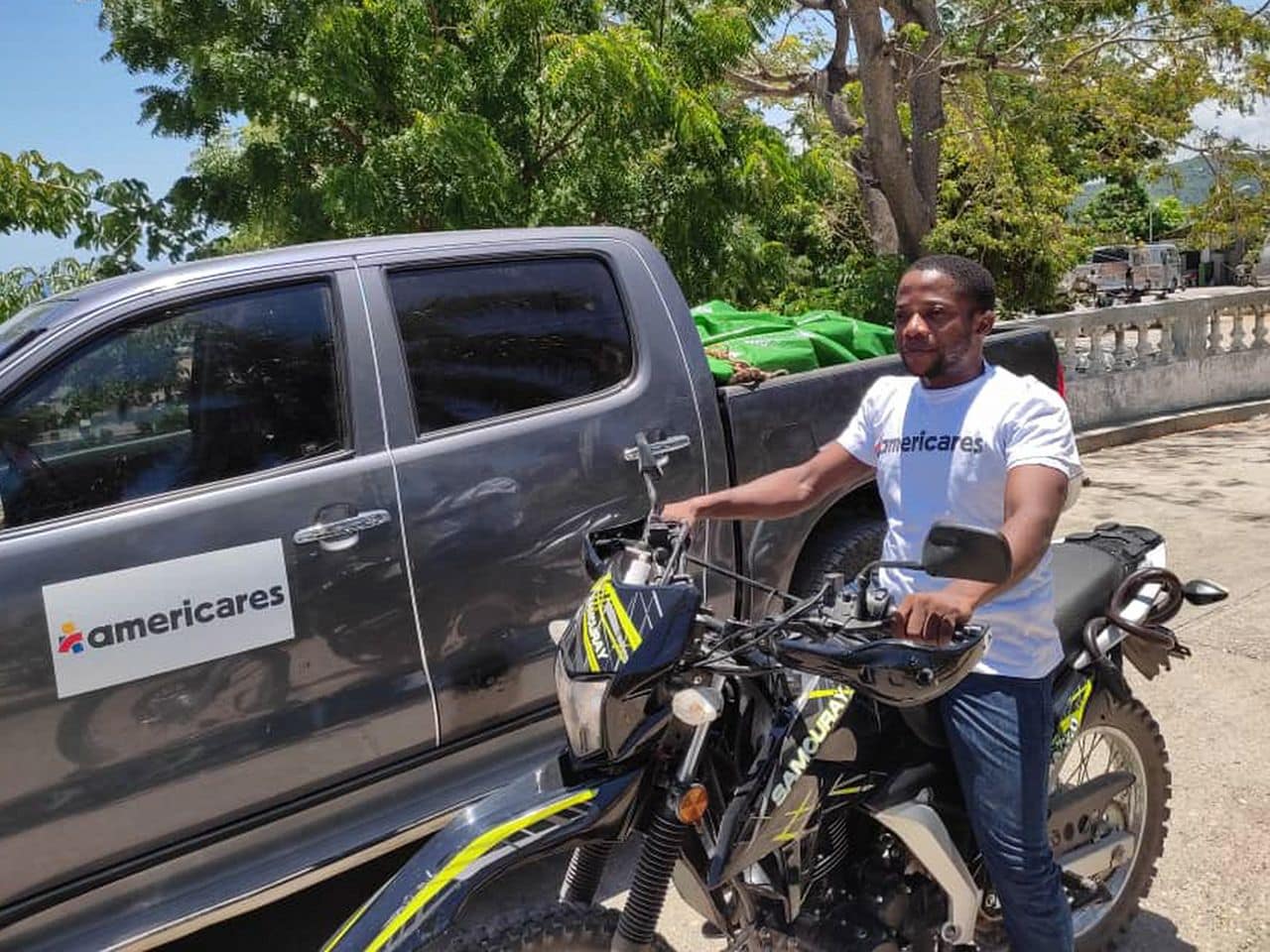 Americares staff member delivering medicines