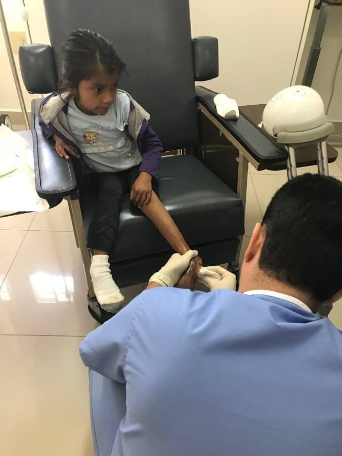 Photo: Doctor cleaning foot wound