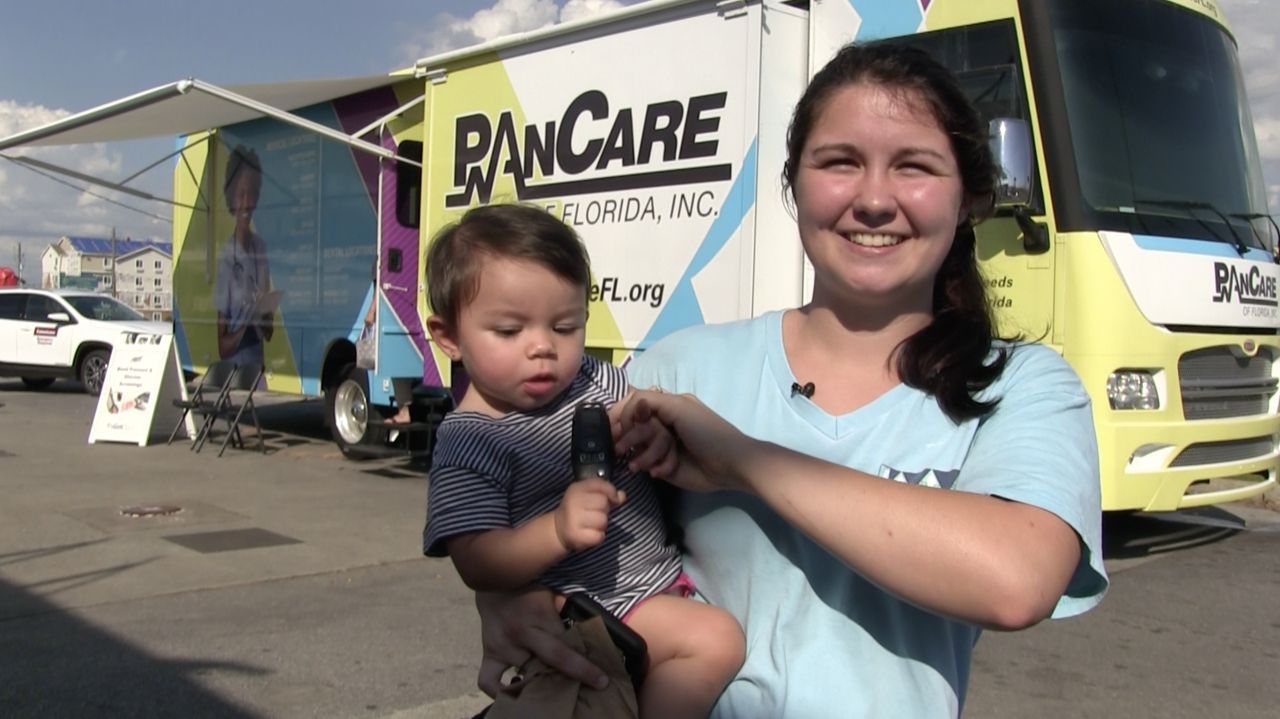 Lauren and her son at the mobile clinic in Panama City