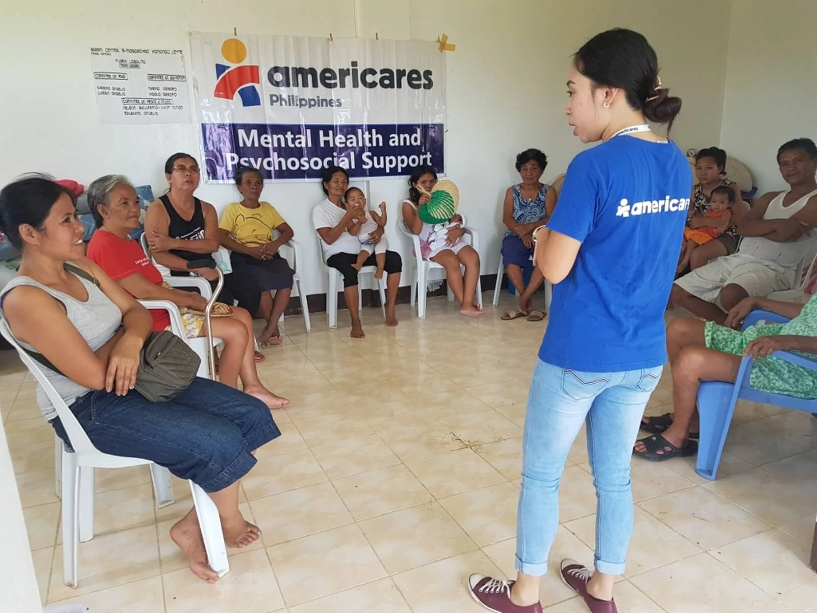 Mental Health Support Group meeting in a small room.